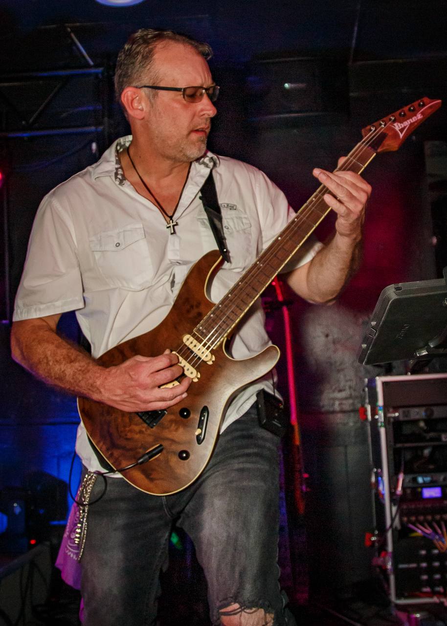Bobby Leavens performing live with burl top Ibanez